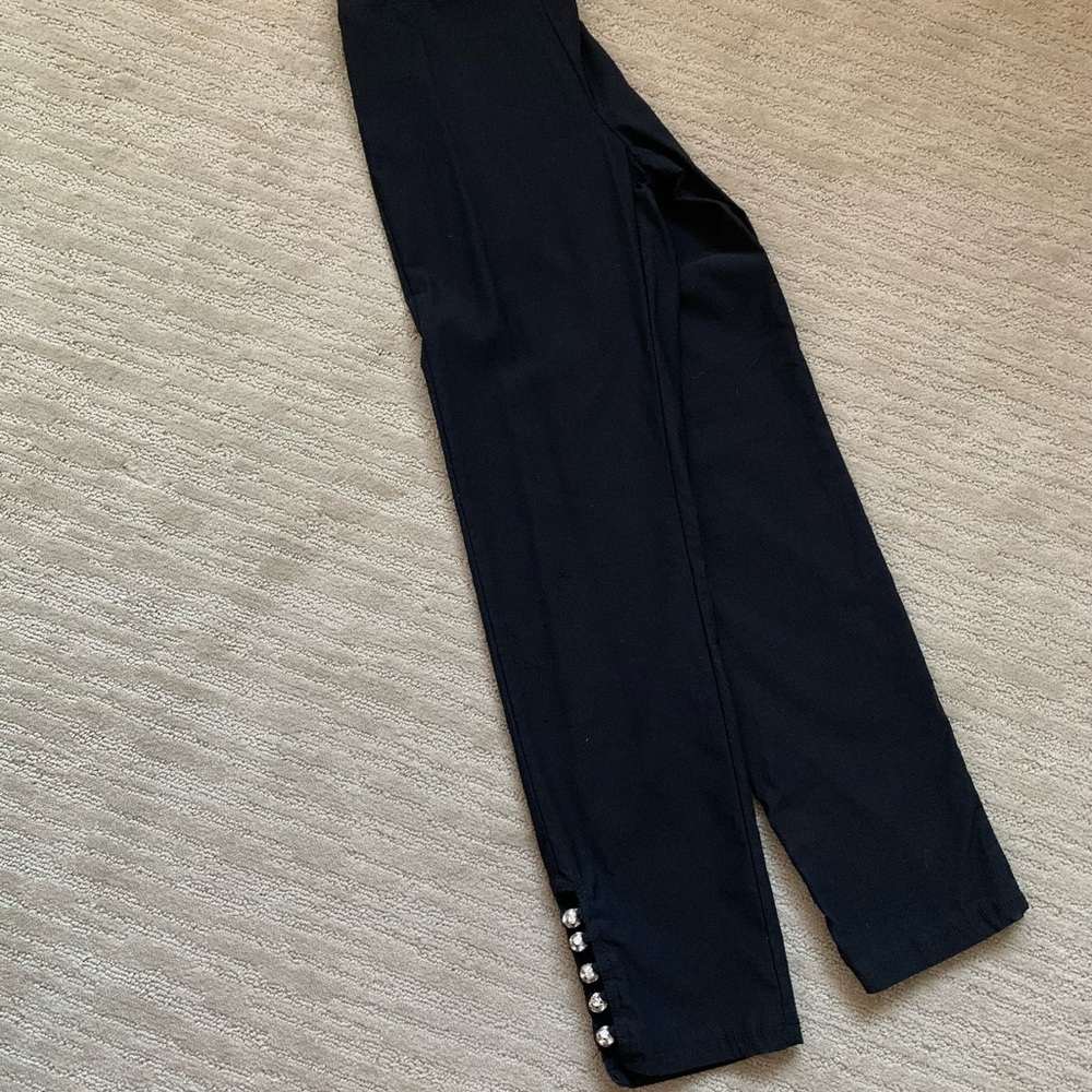 Stretch black pants size 2 with diamond embellished ankle cut outs.